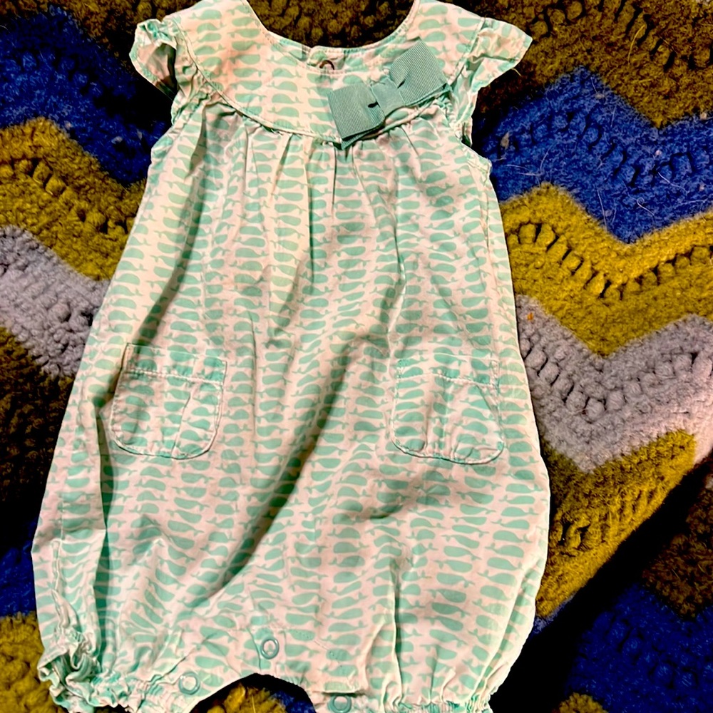 Carter’s 0-3 month light white with green bow. Slightly used
